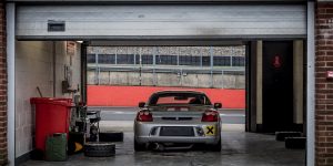 Toyota MR2 sitting in pit garage