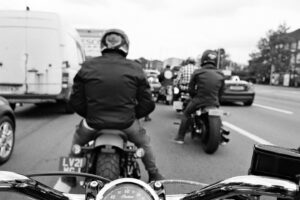 Motorcycle riders waiting in traffic