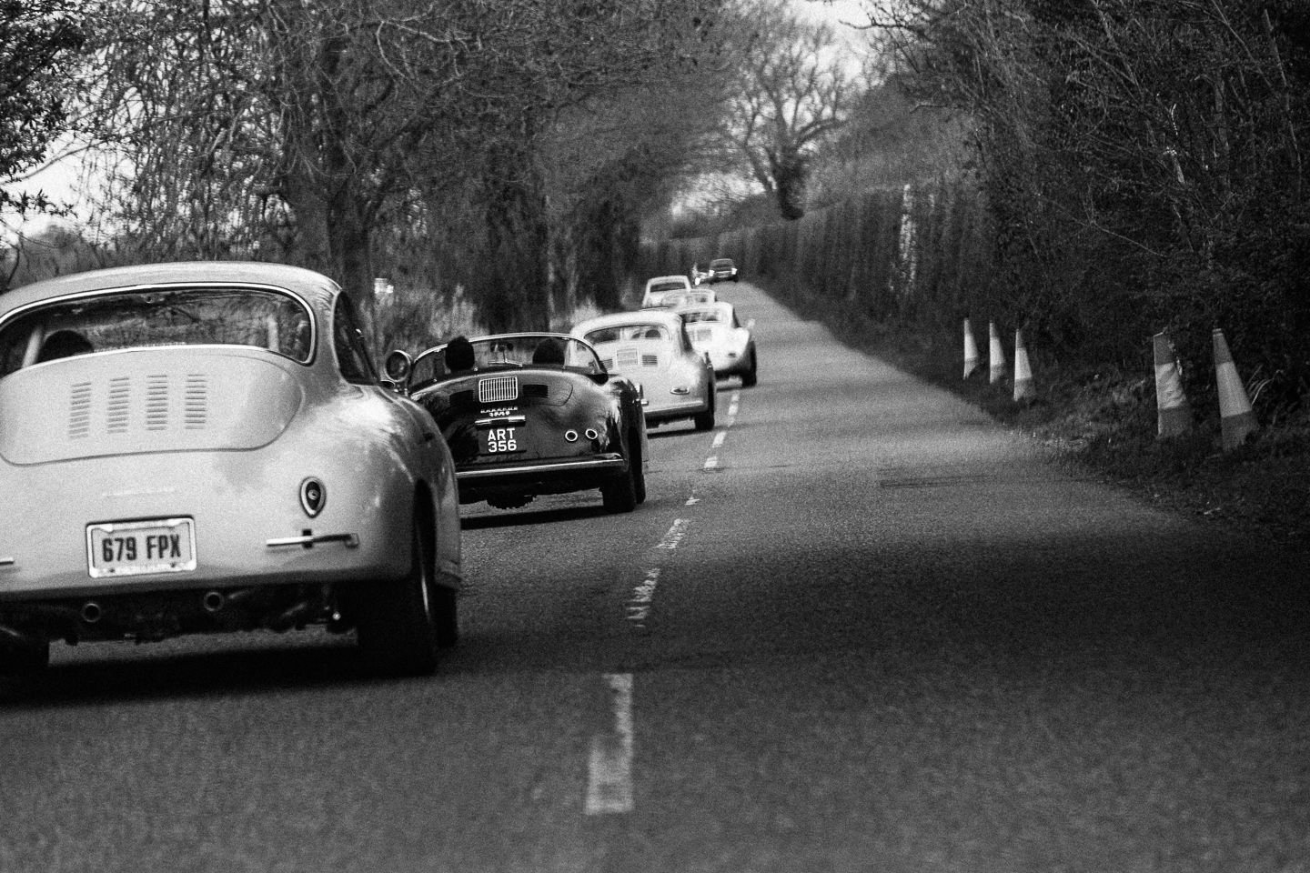 Porsche 356 driving along a military road