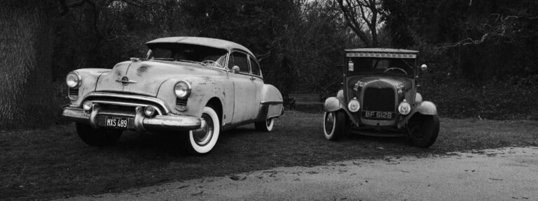 Black and white photo of hot rods at the Detonators monthly meet.
